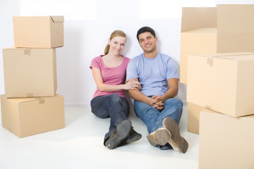 Professional movers handling furniture during Brent removals