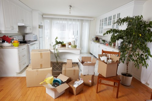 Packed office equipment and labeled boxes prepared for Brent office removals