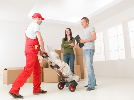 Moving equipment and packed household items ready for transport in Brent