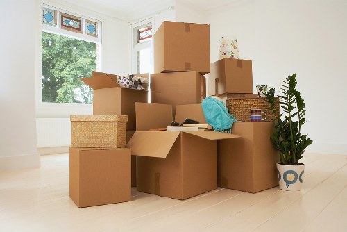 Packed moving boxes ready for transport in Brent