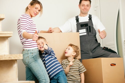 Packed boxes and furniture ready for a Brent flat removal